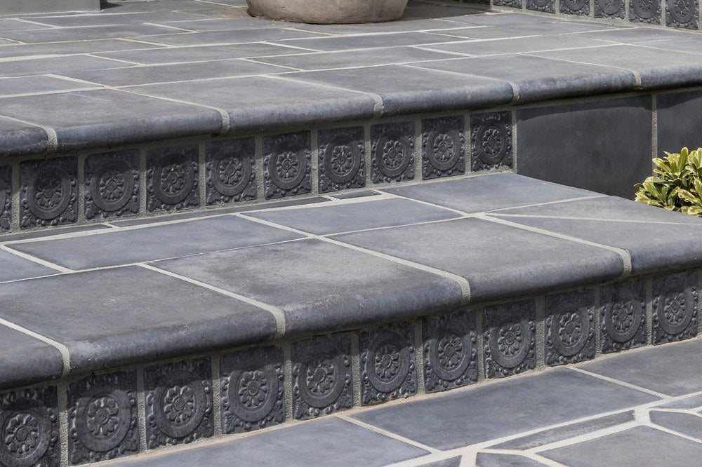 Artillo stairtreads with a deco riser band, Charcoal color, on an exterior entry stair