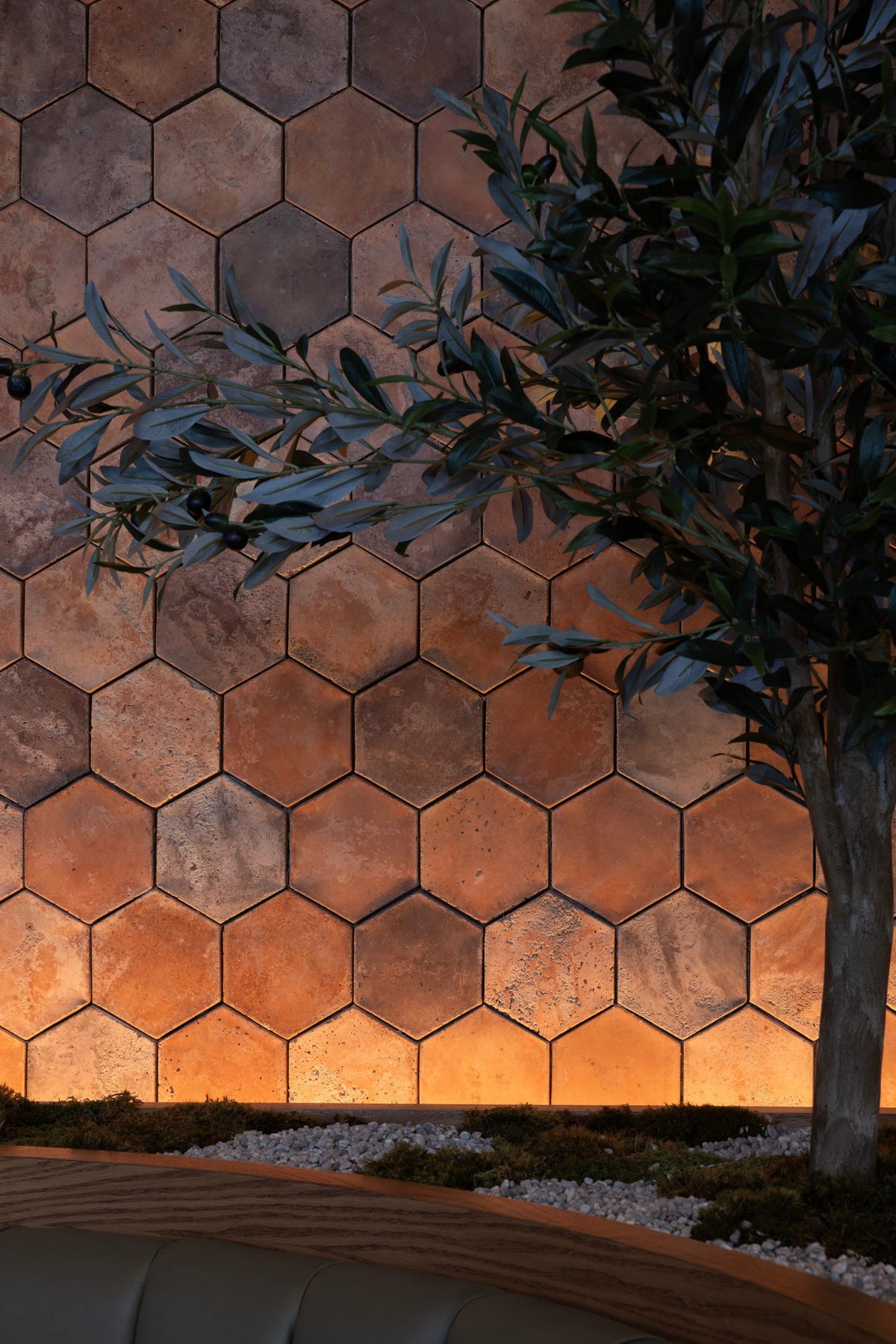 Artillo hexagon wall behind an olive tree