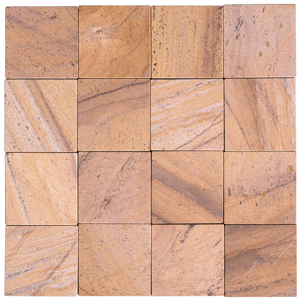 A laid up field of square Stone Born tile in Glow, warm gold and ochre faces with fine dark banding