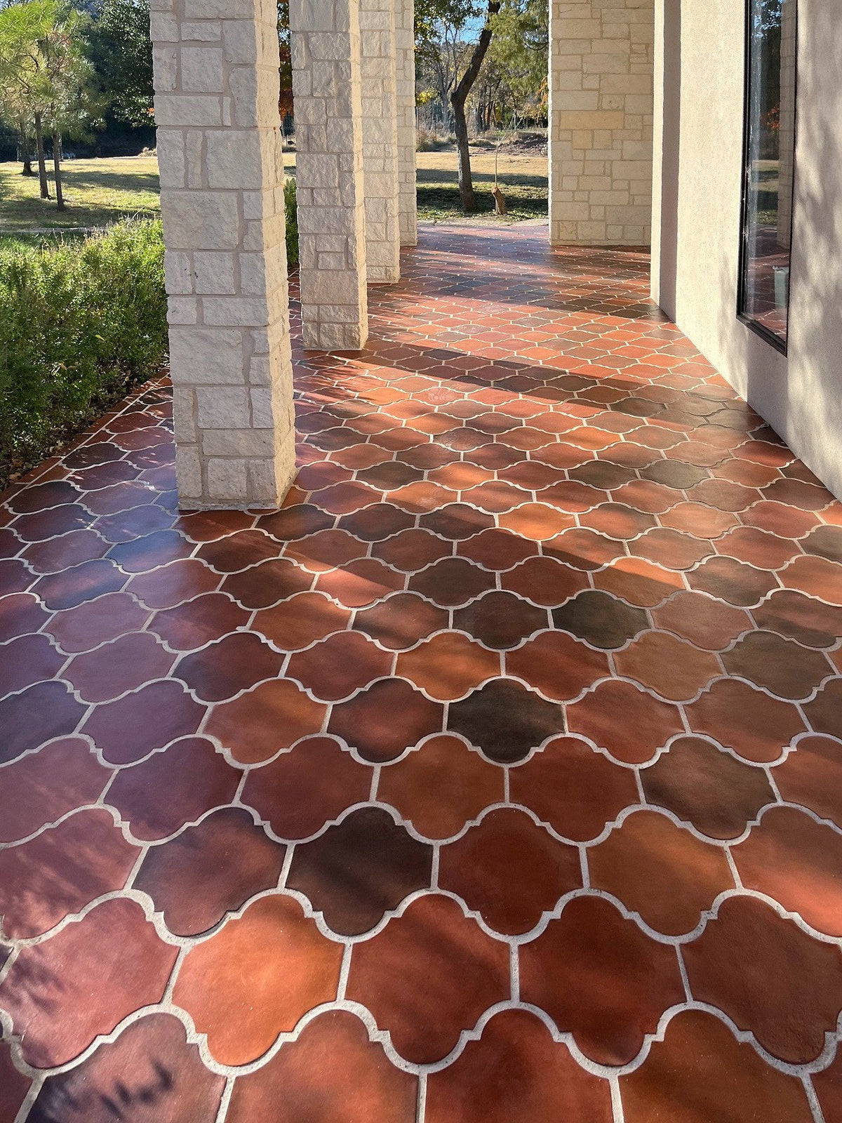 Sunlit loggia floor in Mission Red