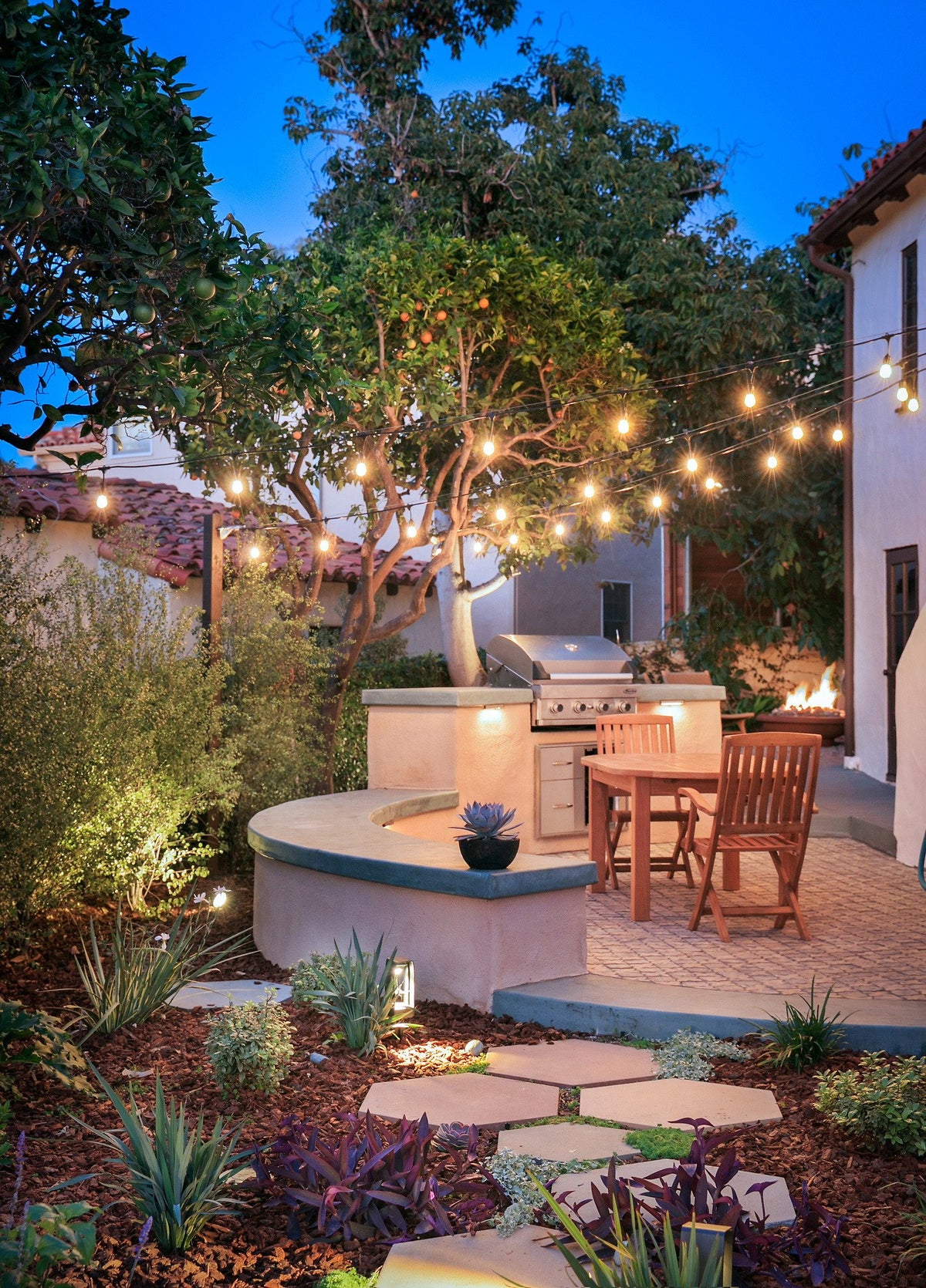 Patio and outdoor grill at dusk