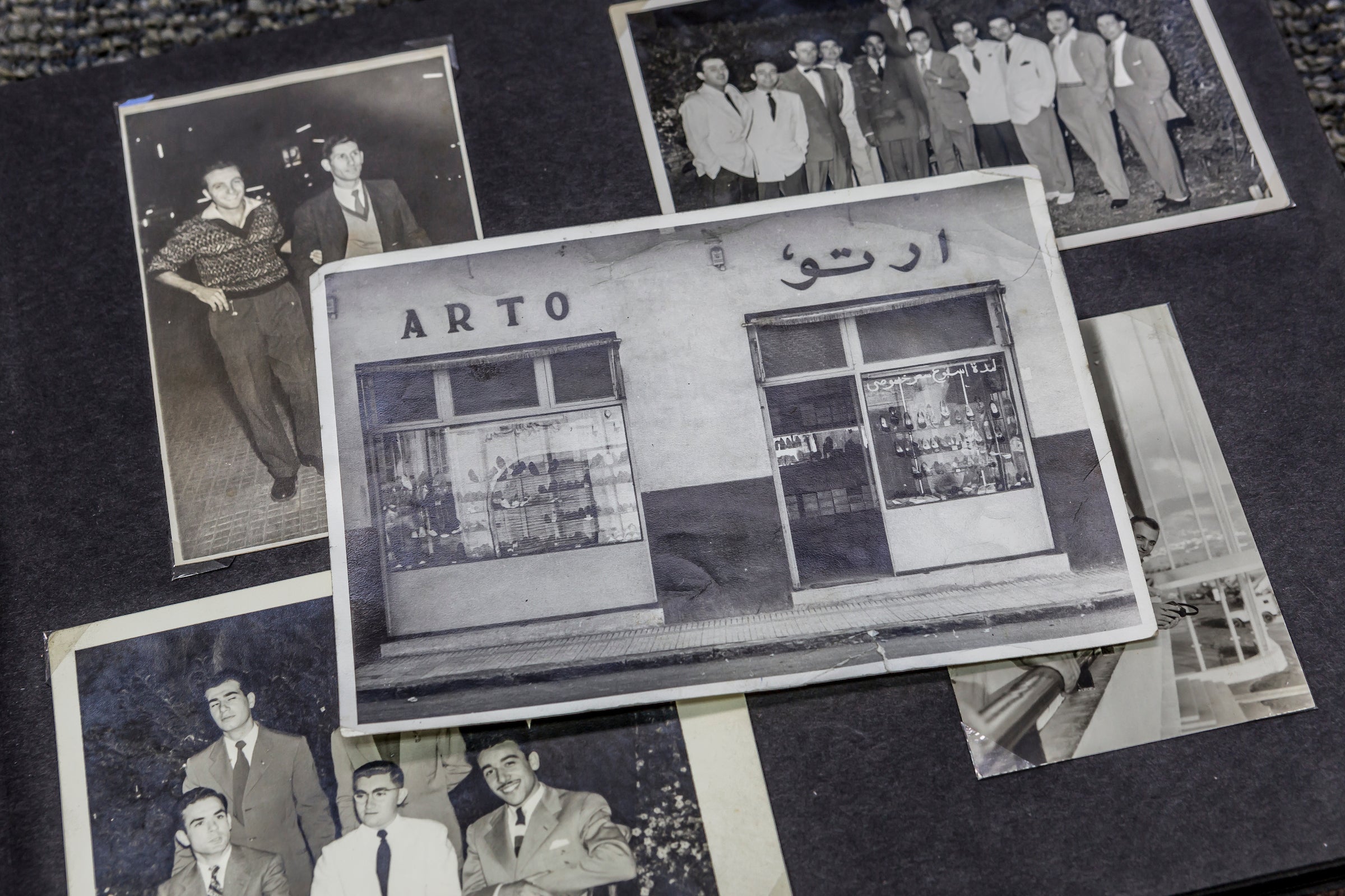 Vintage black and white family photos, including a shoe storefront with ARTO written in English and Arabic above the windows