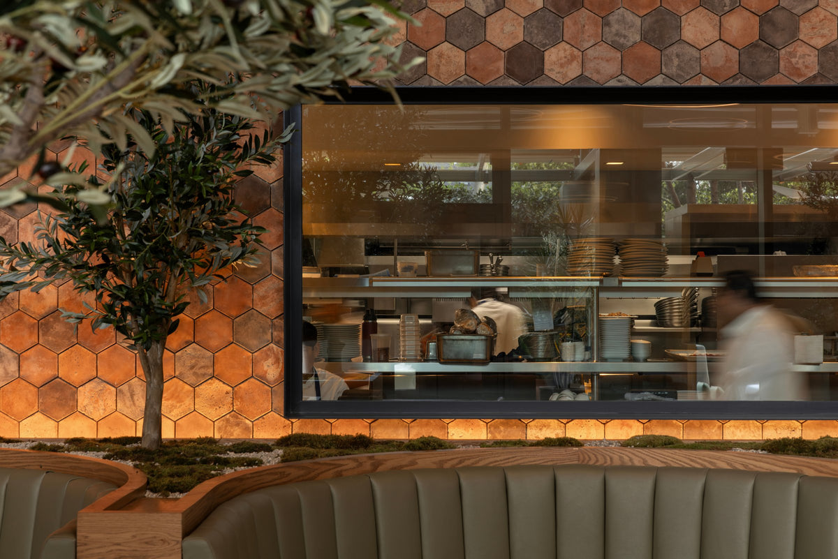 Open kitchen framed by hexagon tile