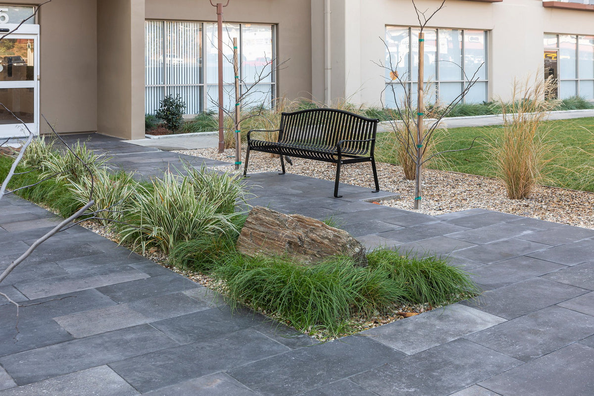 Bench beside Anticato Nero paving