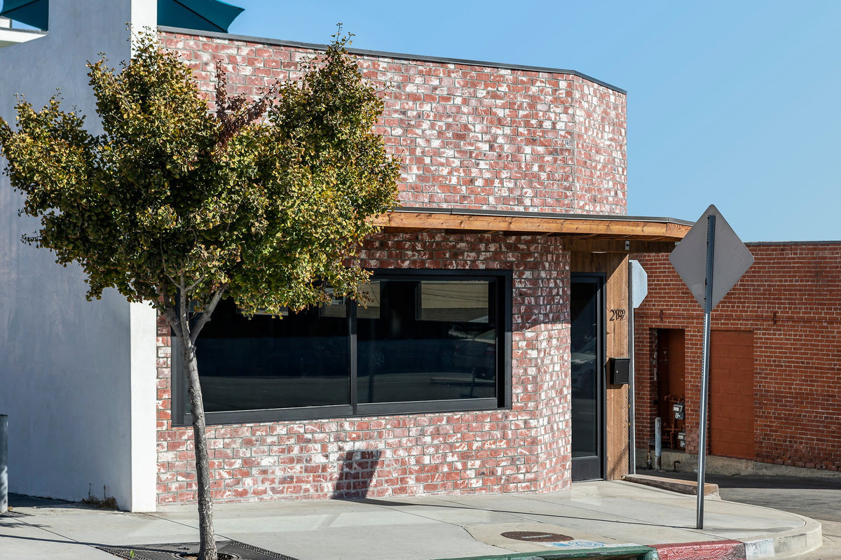 Curved brick facade by the street