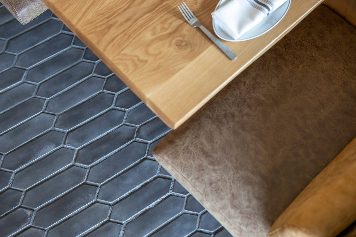 Picket tile beneath a booth table