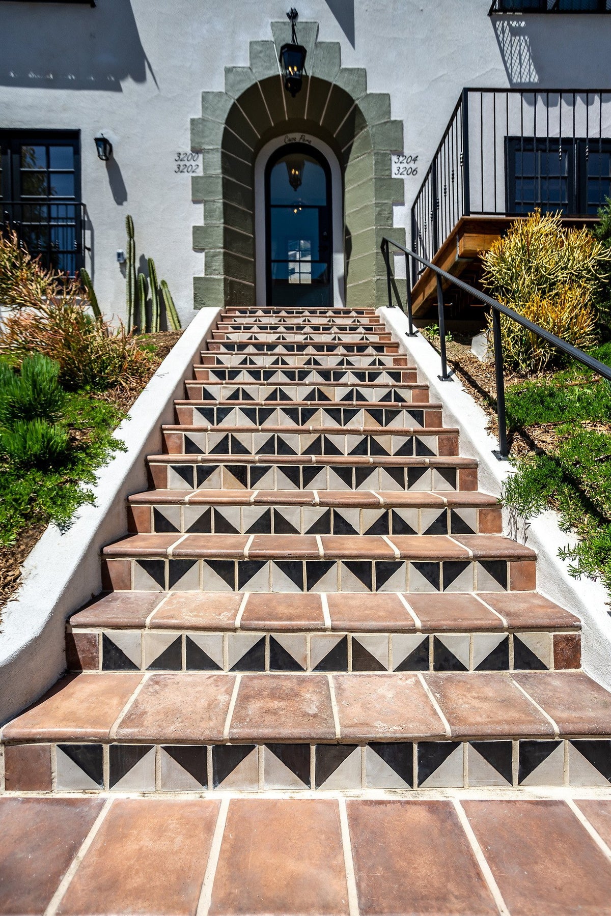 Front steps up to the arched door