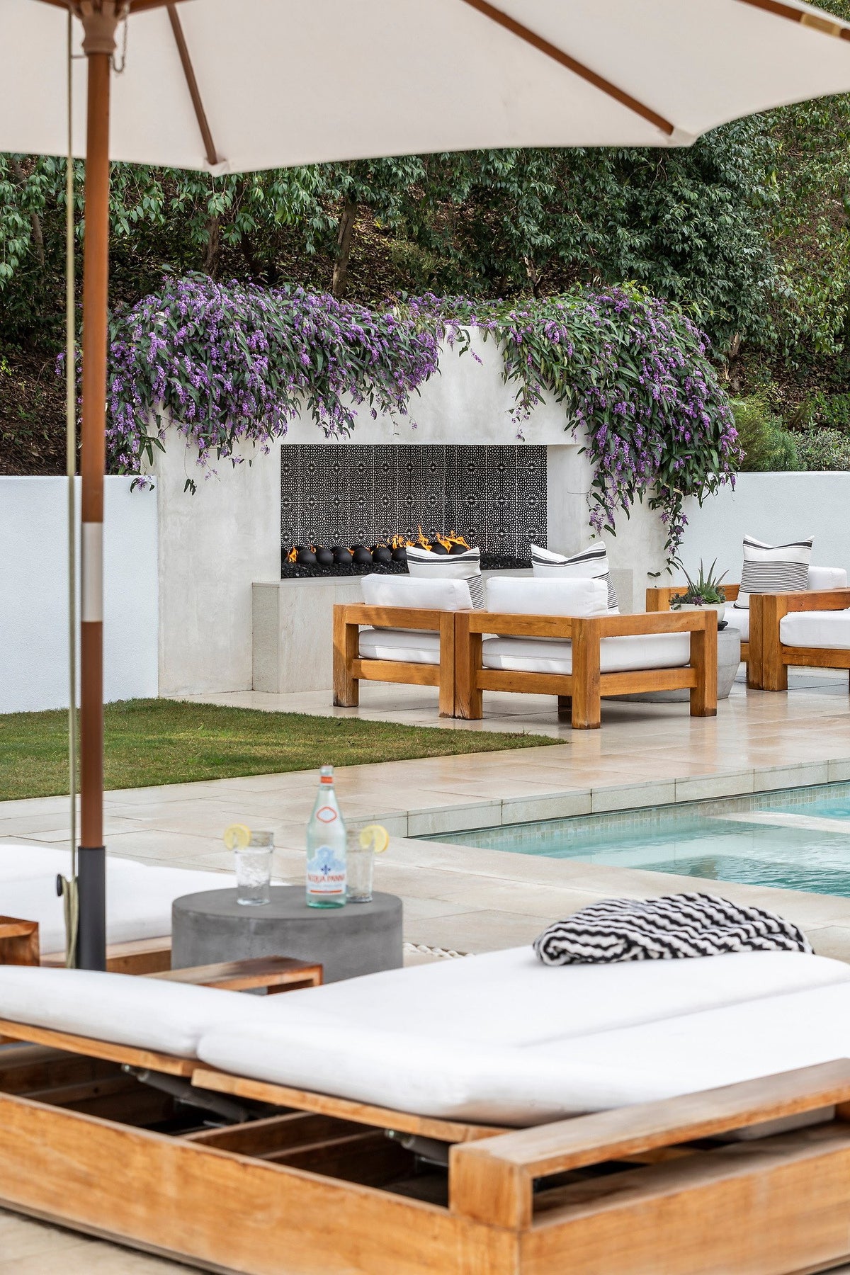 Fireplace beyond the pool deck