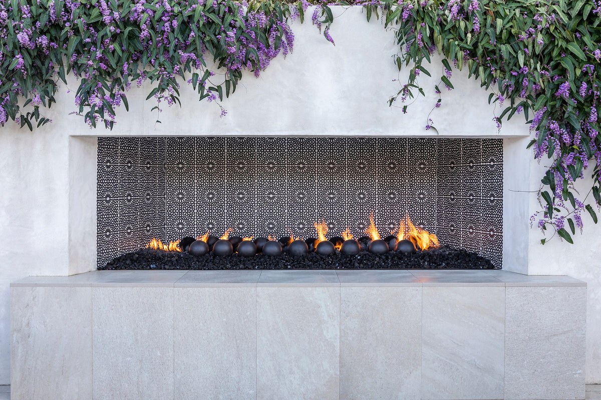 Linear fireplace with patterned firebox