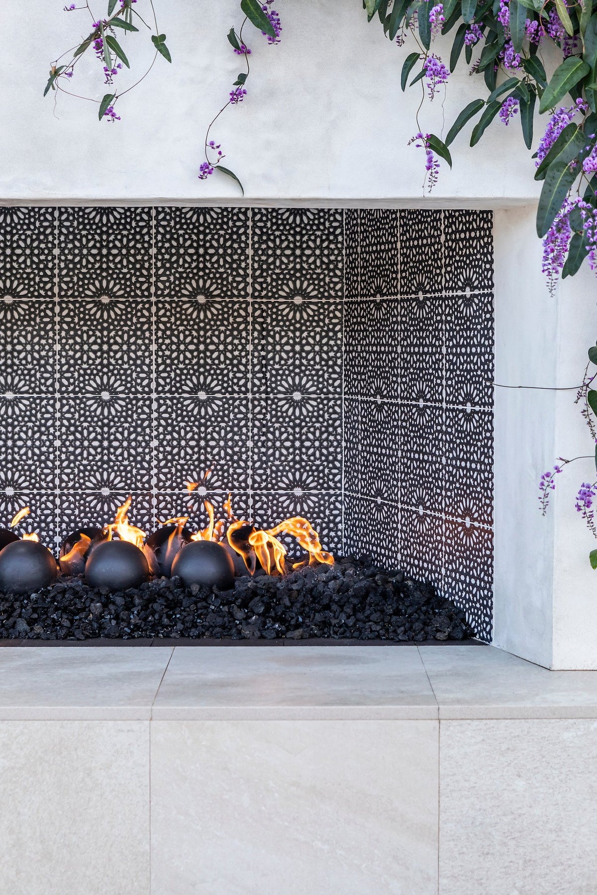 Deco tile wrapping the firebox