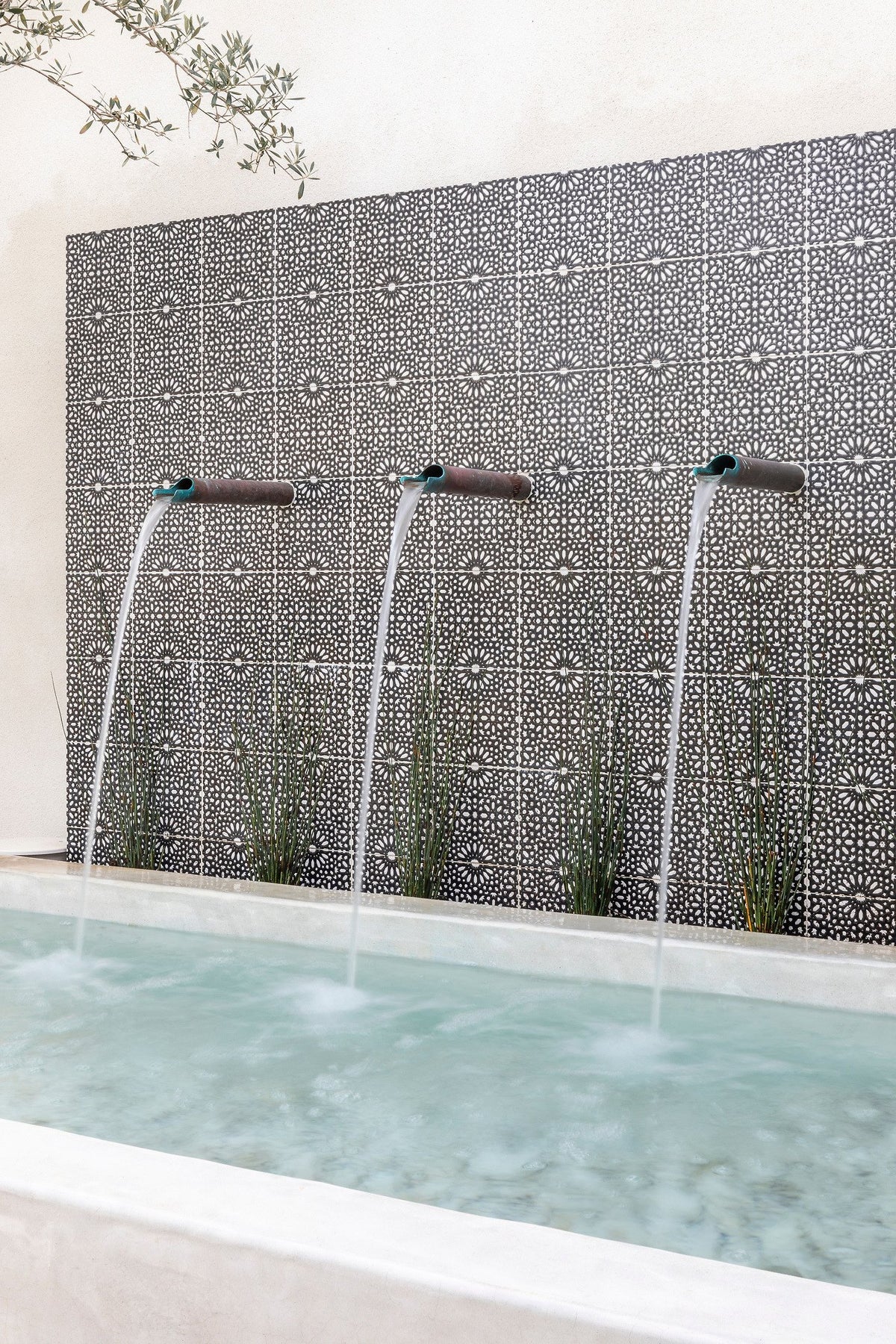 Water spilling from the tiled wall