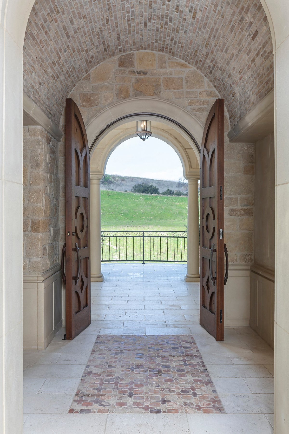 Tile rug in the barrel-vaulted foyer