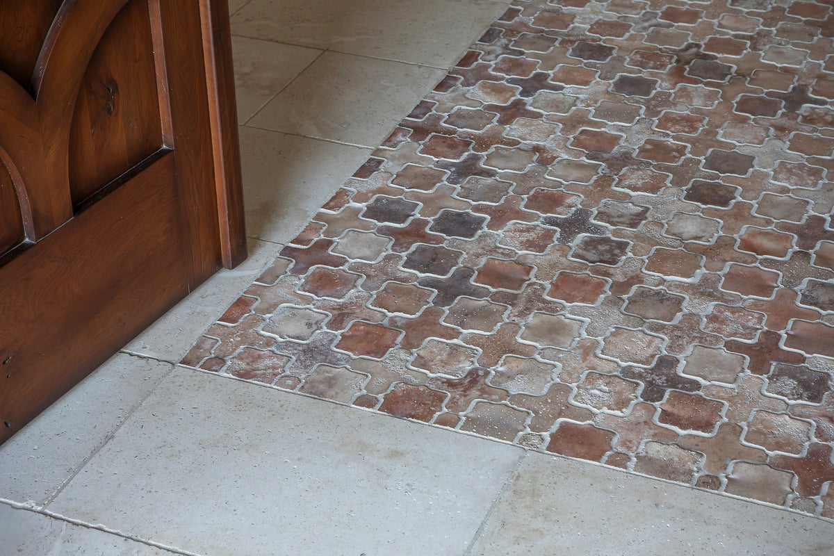 Tile rug edge by the front door