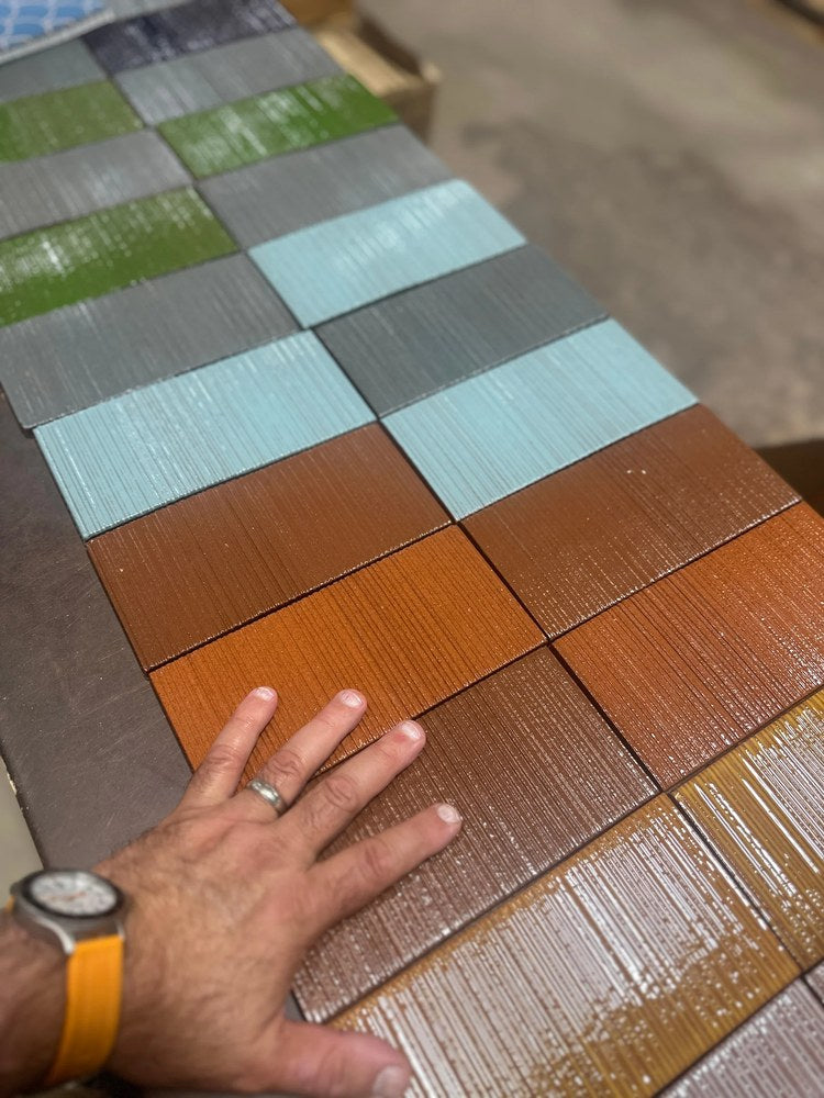 Glazed ARTO Corduroy tiles laid out together in greens, greys, blues and reds