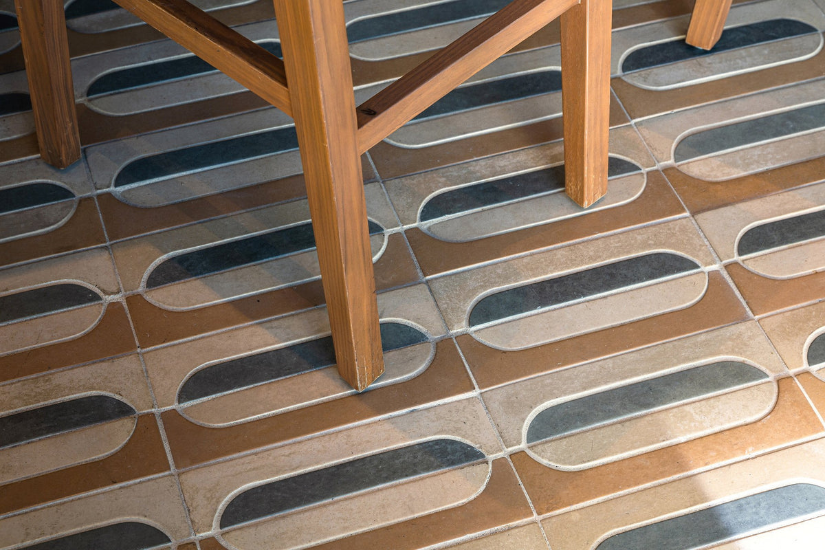 Chair legs on the striped tile