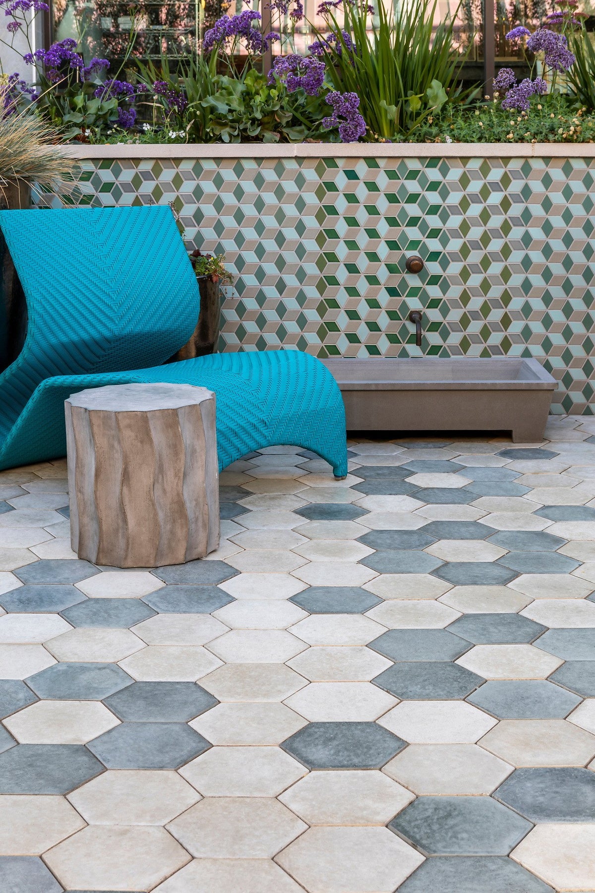 Hexagon pavers below the tile wall