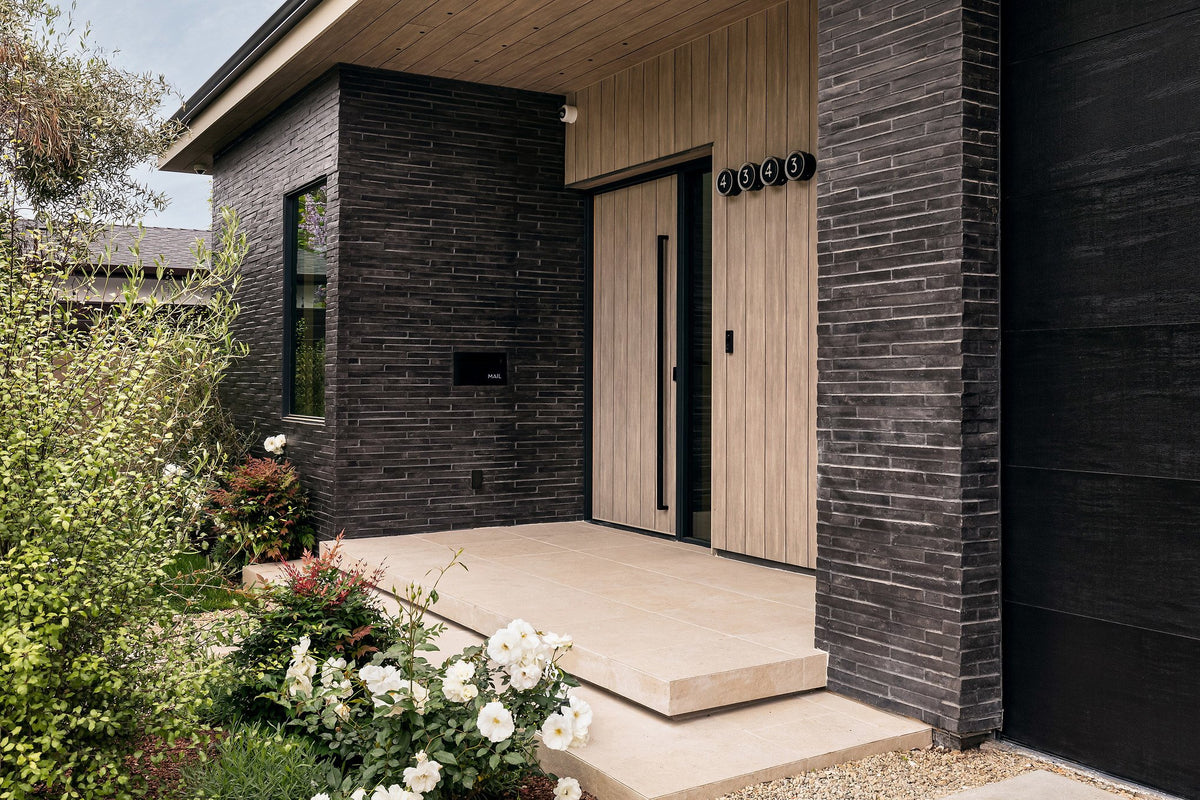 Entry porch wrapped in Charcoal brick