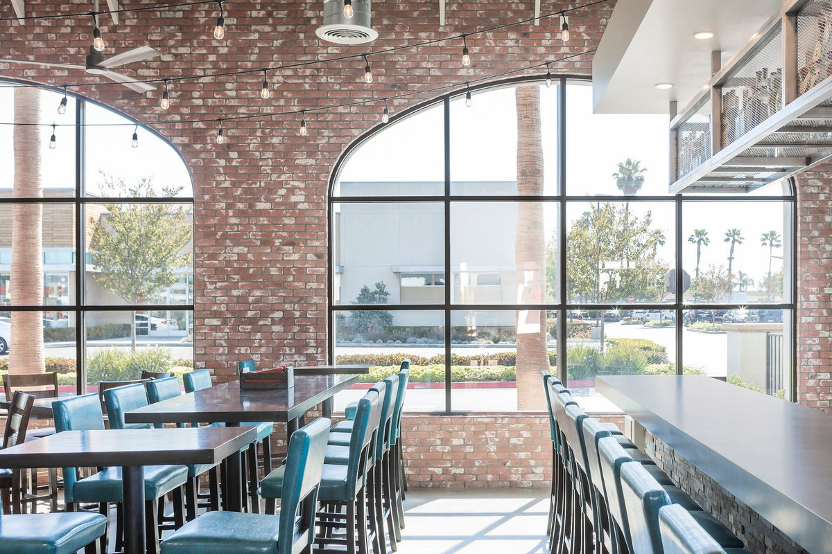 Brick wall over the bar seating