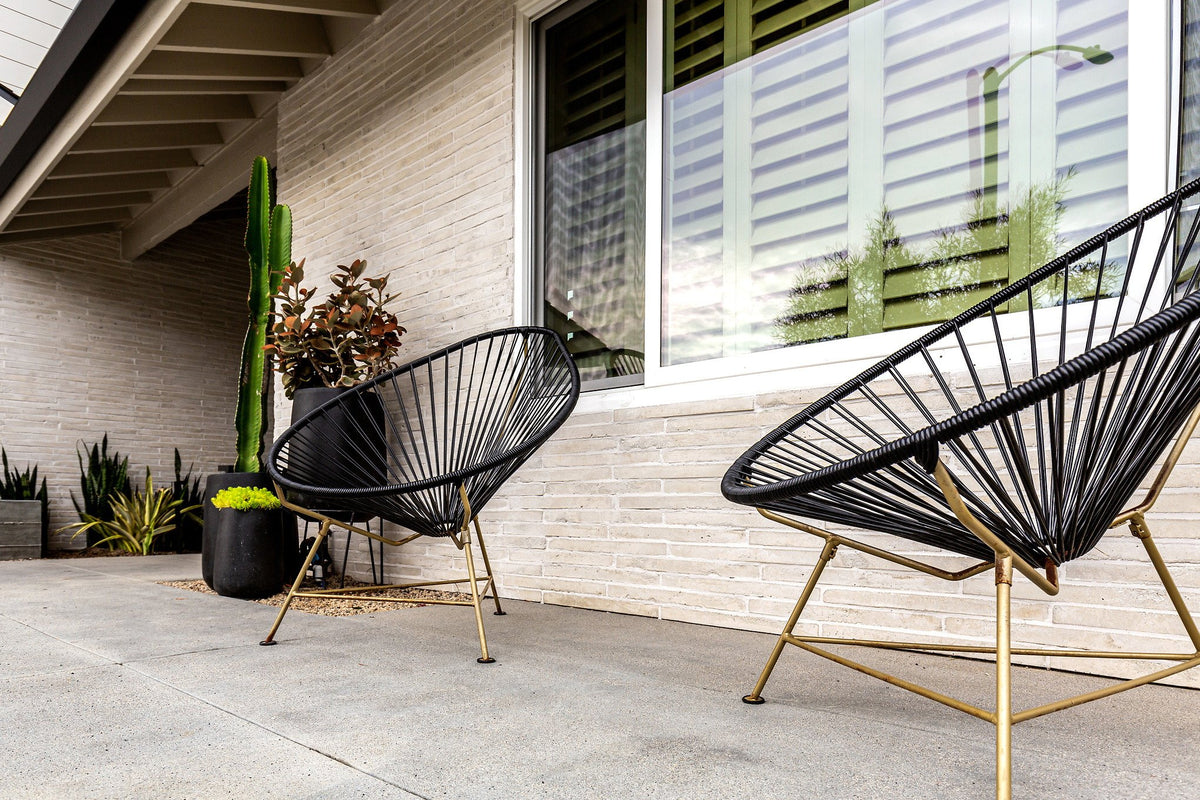 Covered patio with brick wall