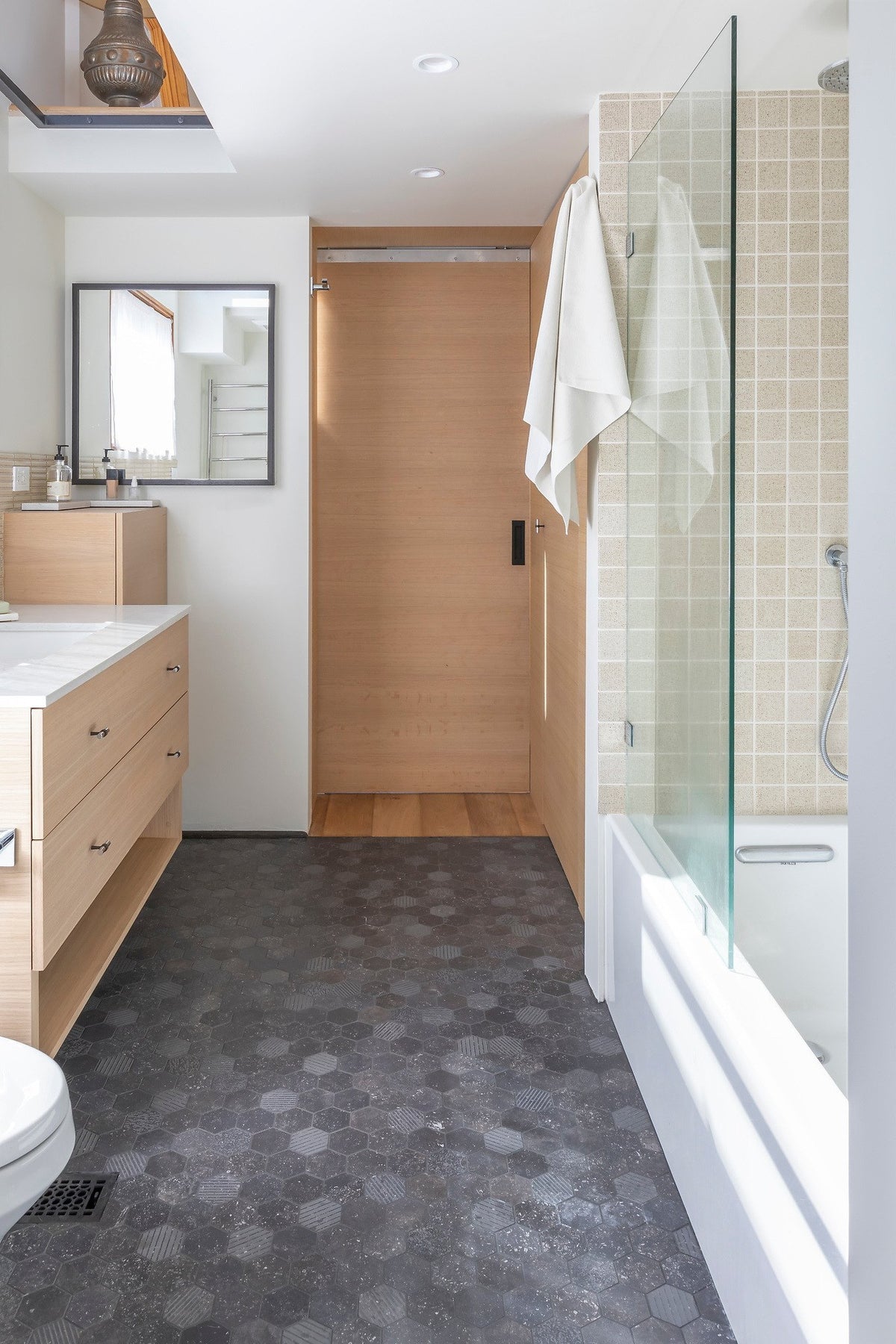 Bathroom with porcelain hex mosaic floor