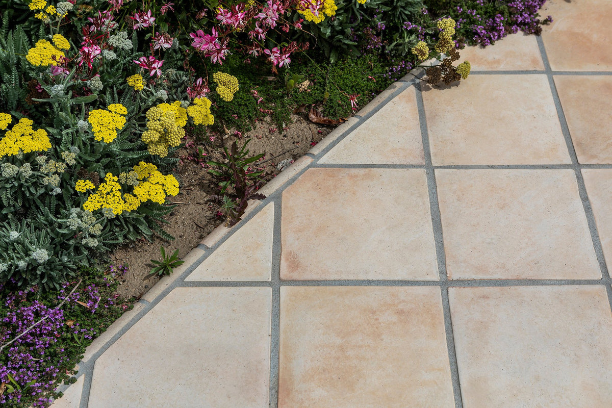 Tile edge meeting the flower beds