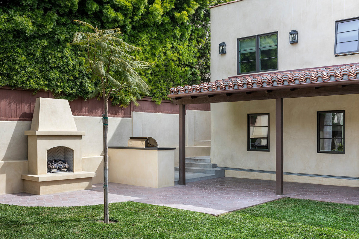 Backyard patio with outdoor fireplace