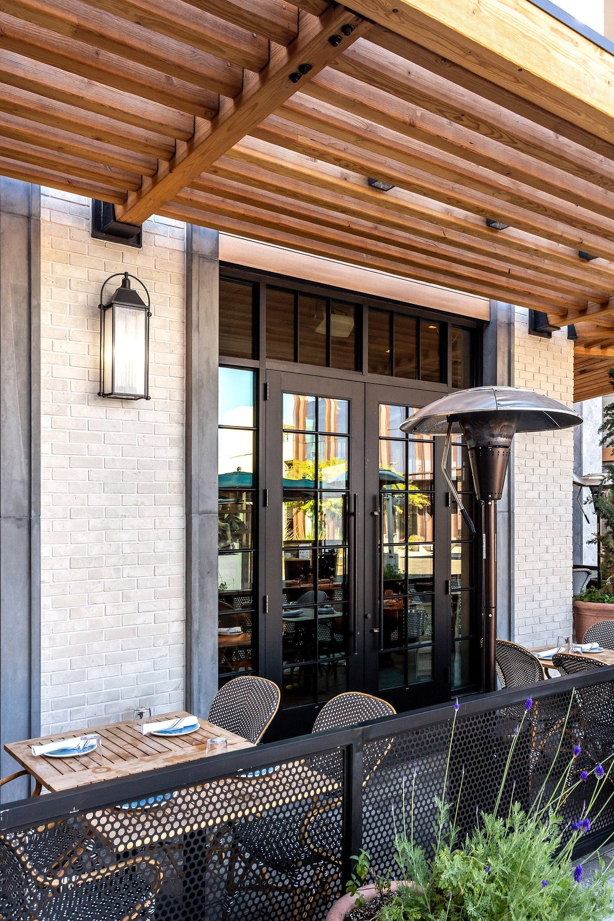 Pergola, lantern and brick facade