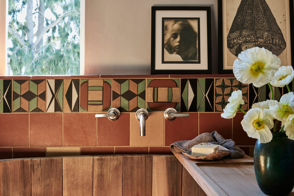 Hand-painted deco tiles at the tub