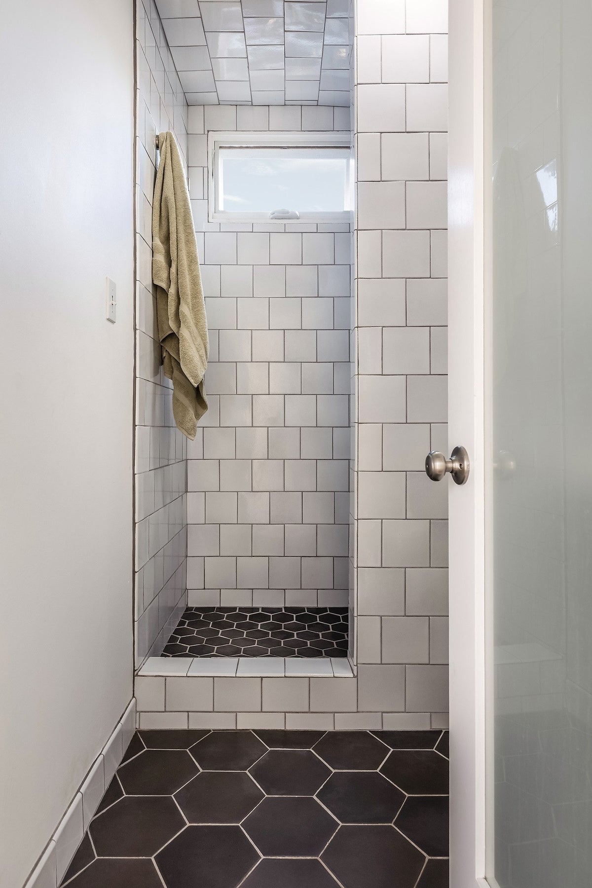 Walk-in shower with white Studio walls