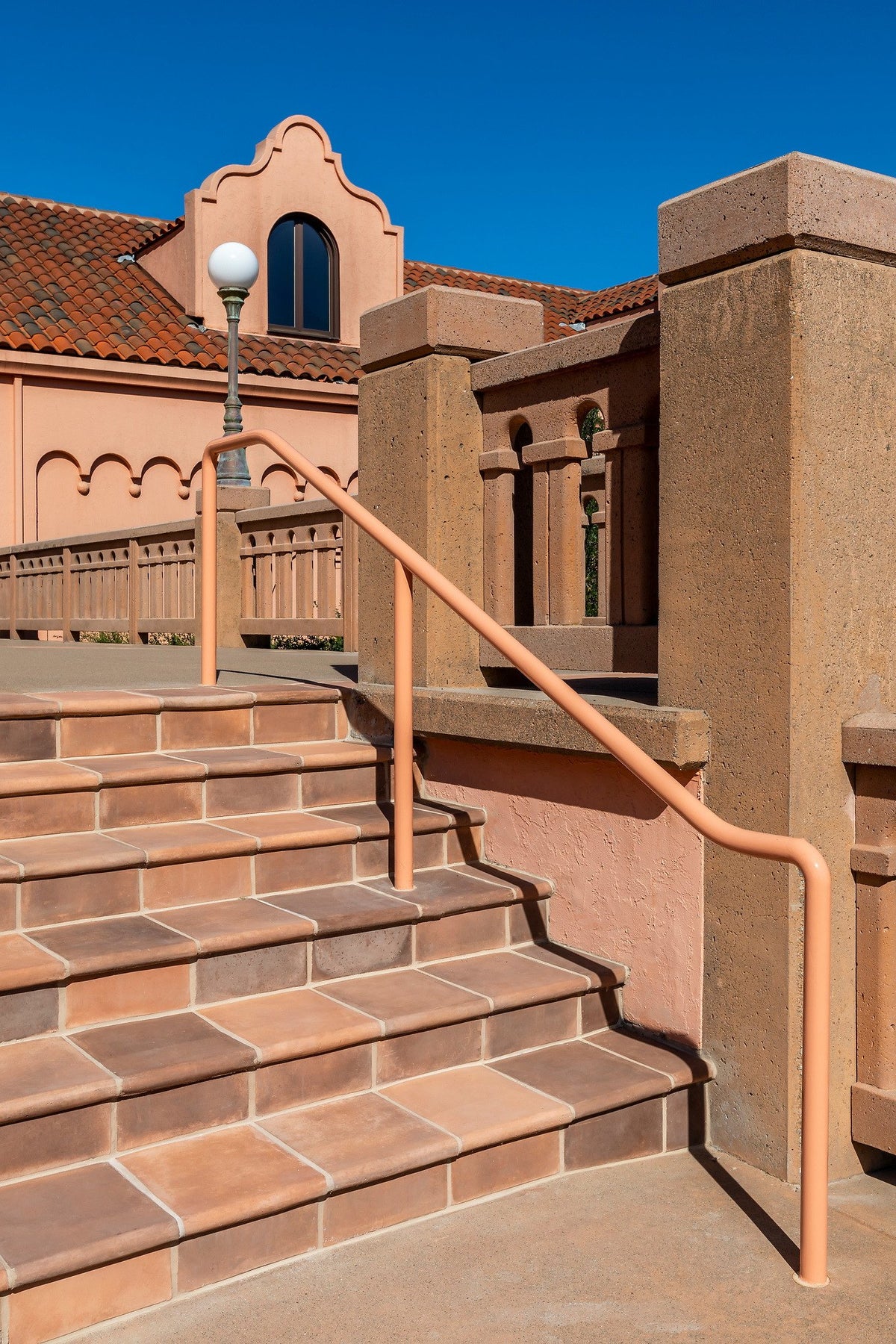 Steps along the handrail and wall