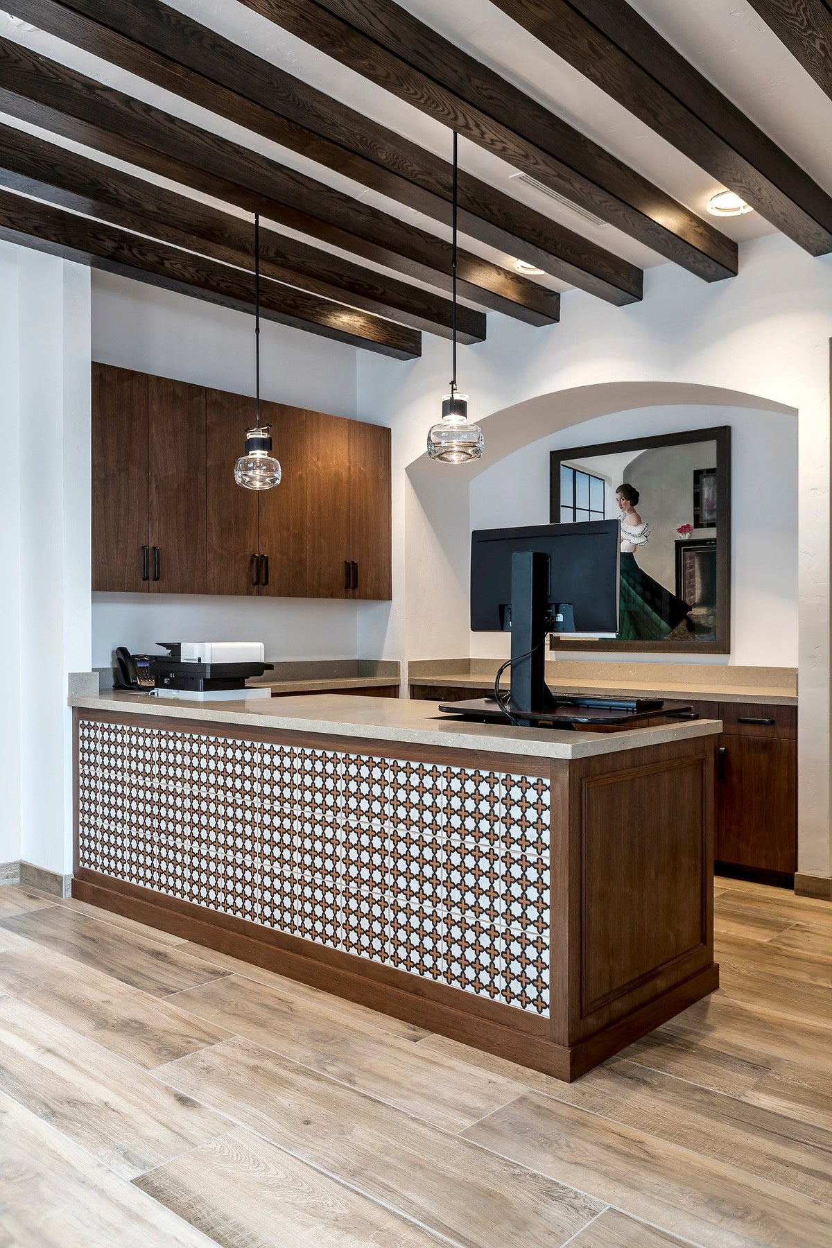 Lobby with beamed ceiling and desk