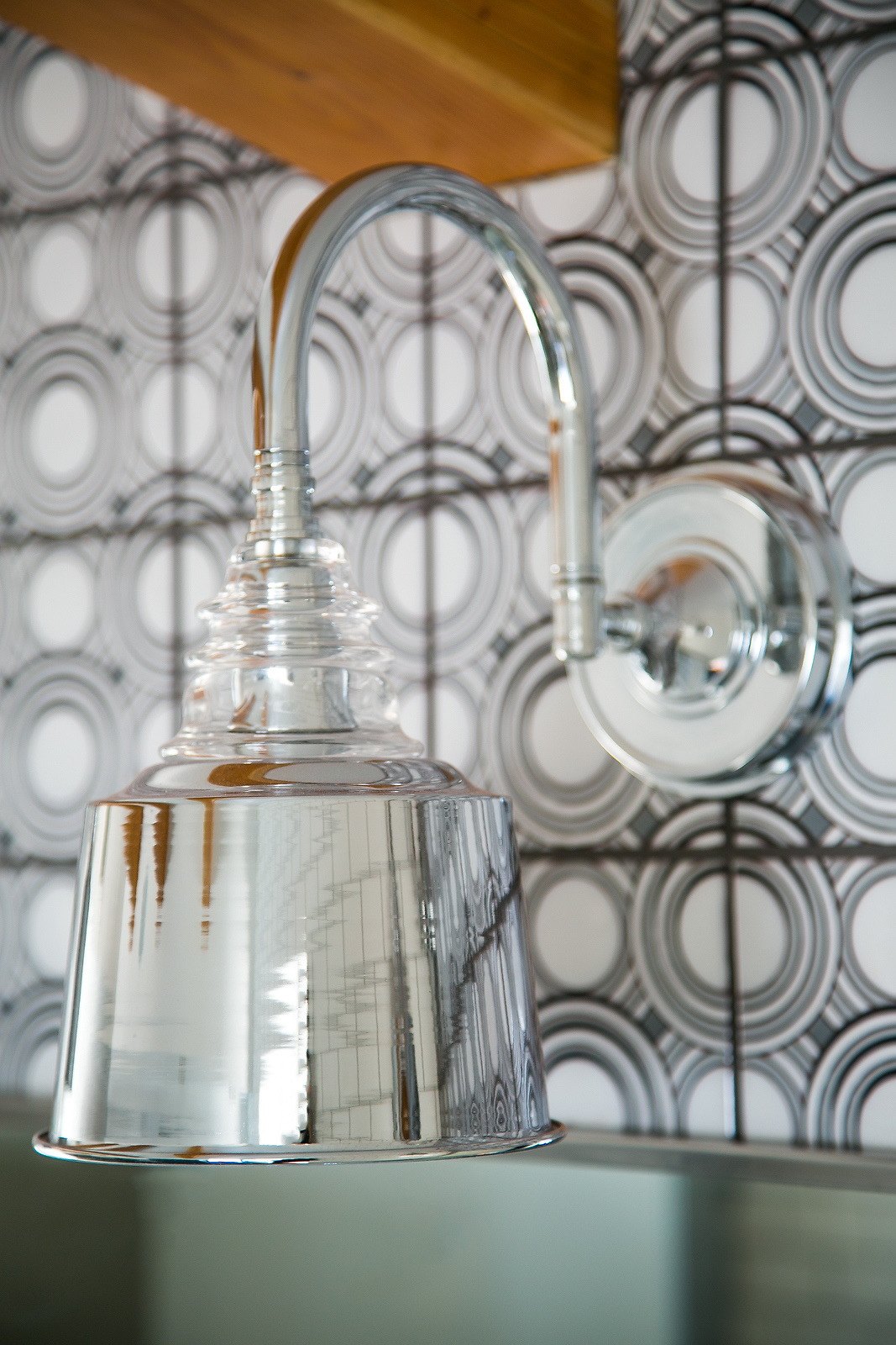 Chrome sconce on Rings tile