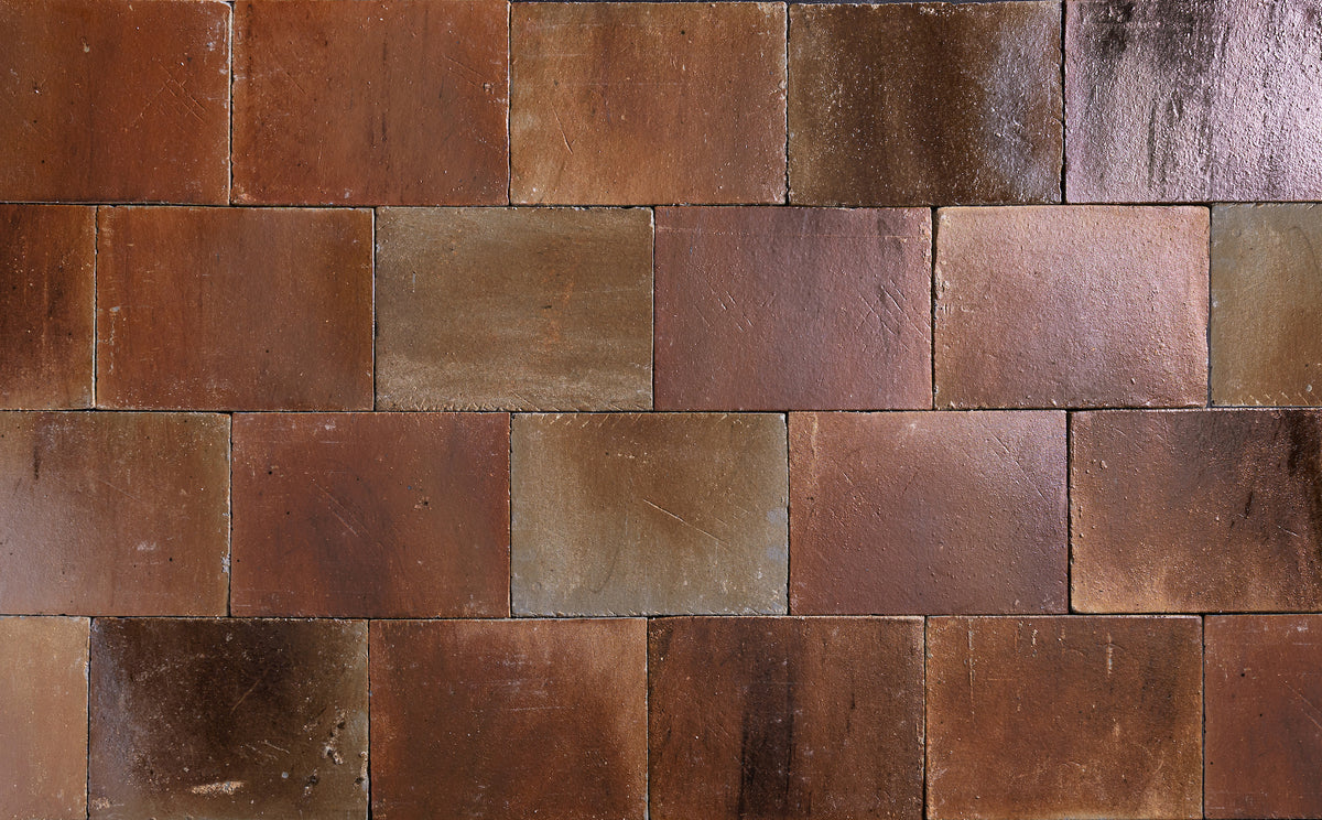 A field of Suna laid in rows, copper and bronze with paler pieces among them