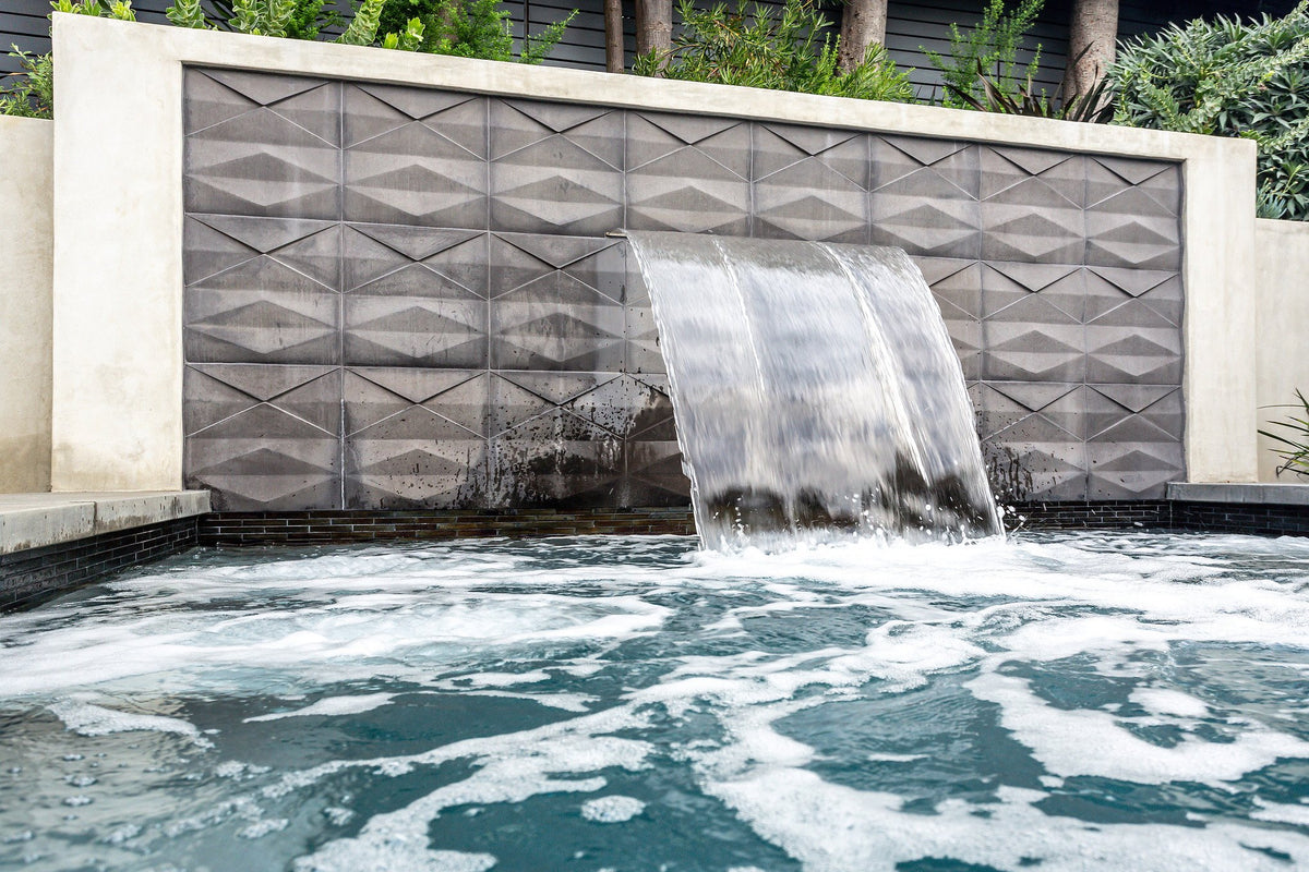 Waterfall and textured wall