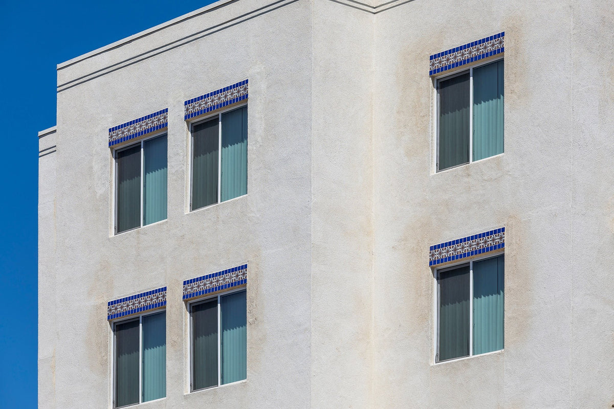 Blue deco bands above windows