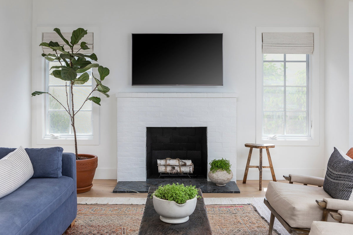 Living room with white brick fireplace