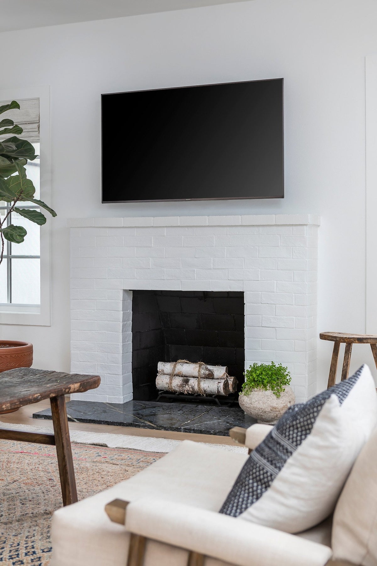 Painted brick veneer fireplace surround