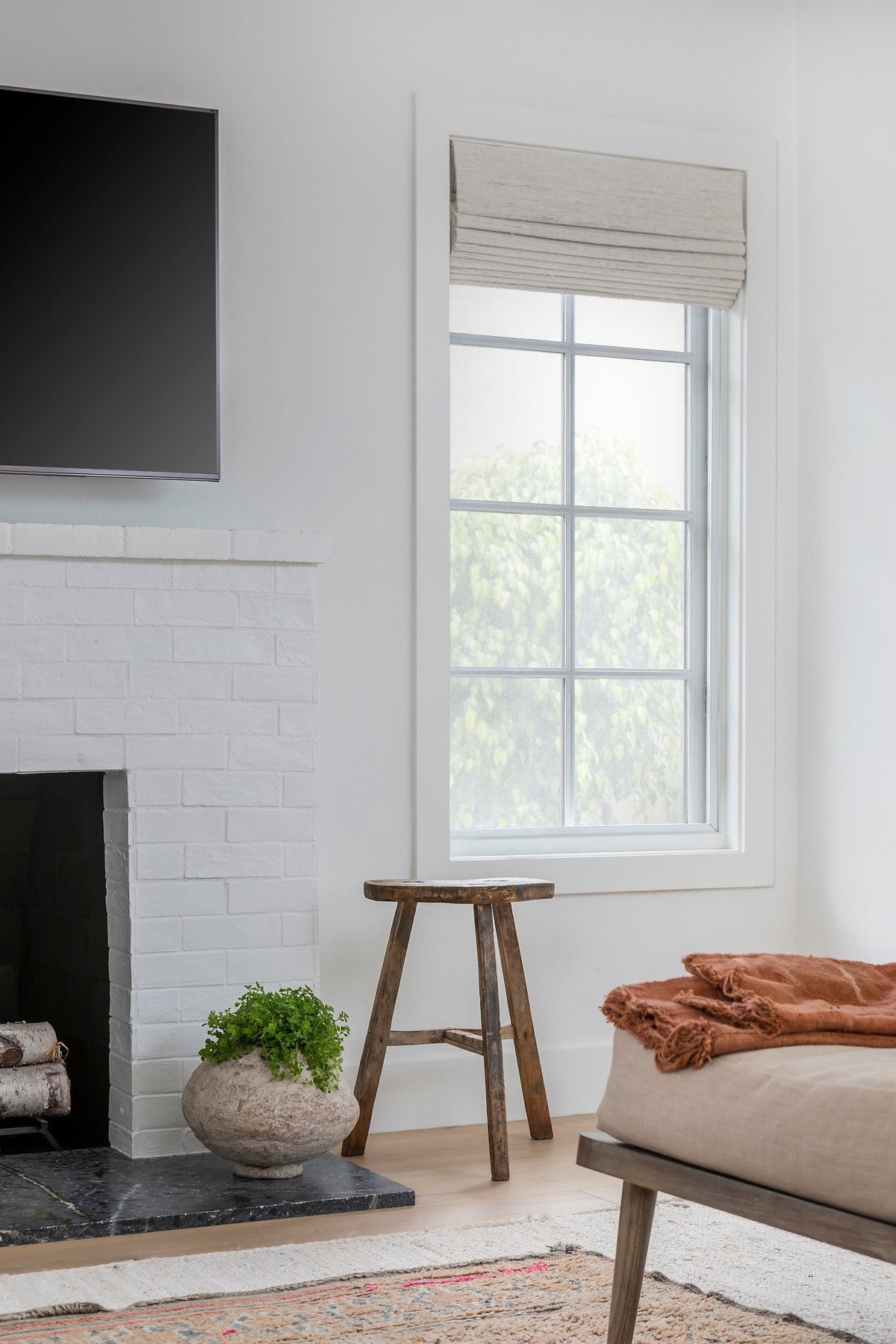 Brick fireplace beside the window