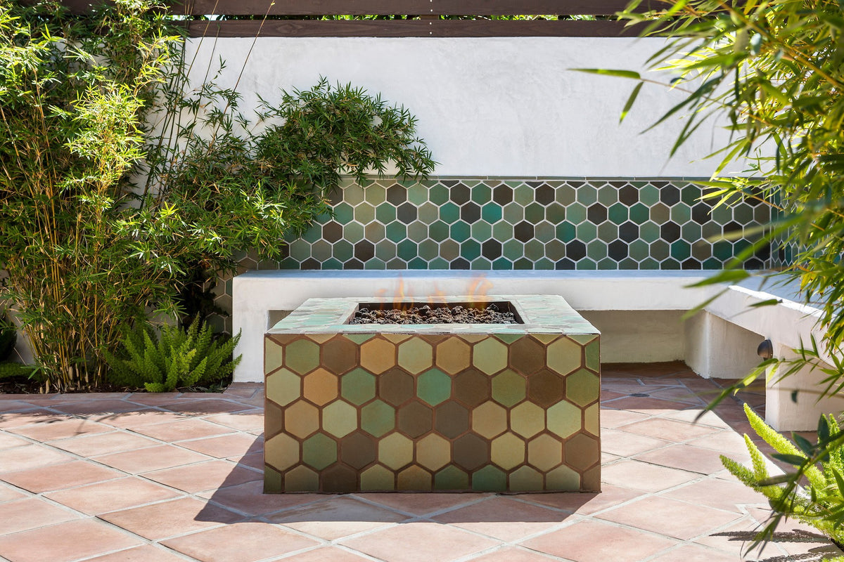 Hexagon-clad fire pit in green blend
