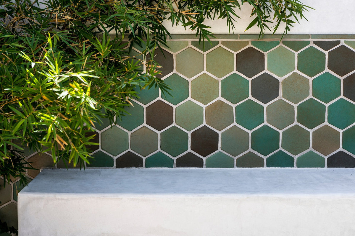 Green hexagon tile behind the bench