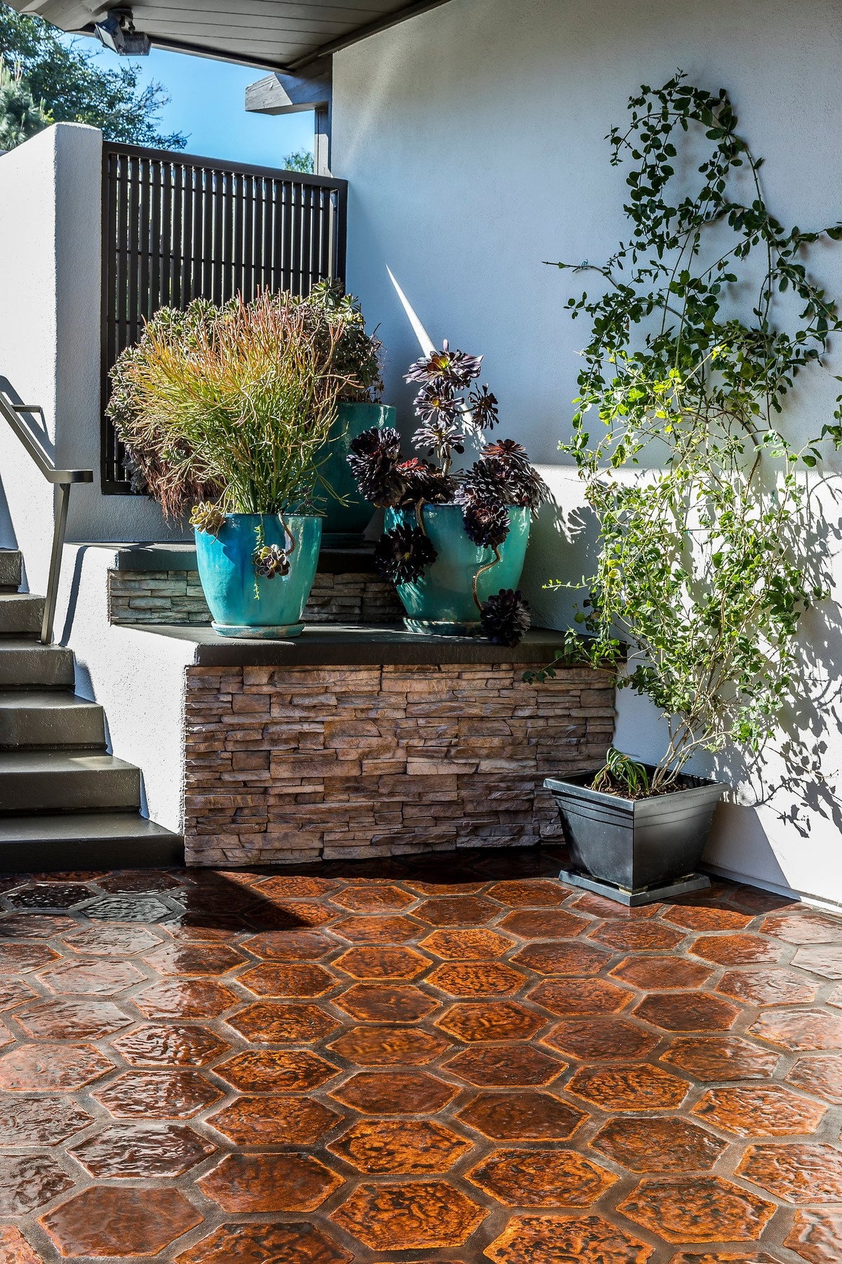 Hexagon floor by a stone planter