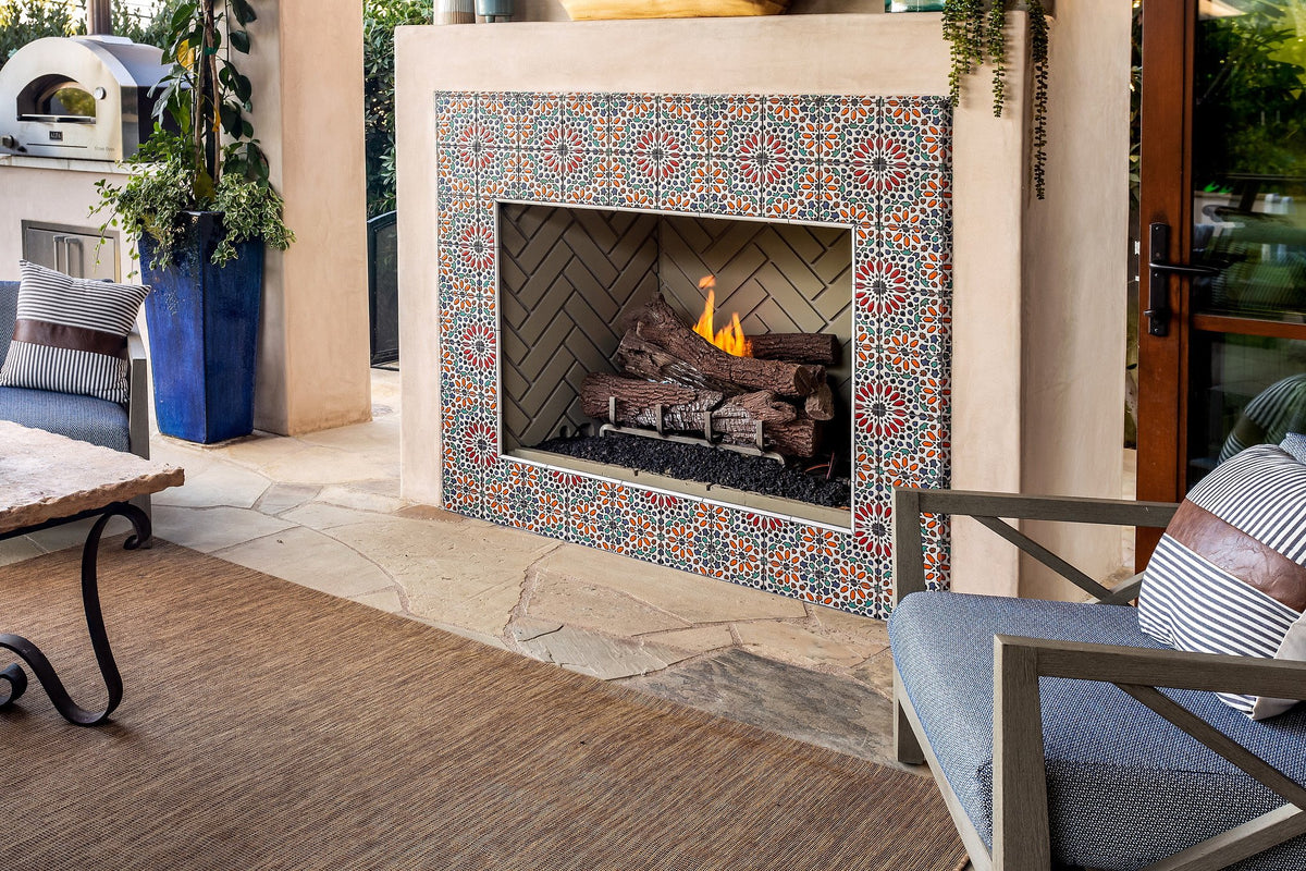 Lit fireplace framed in deco tile