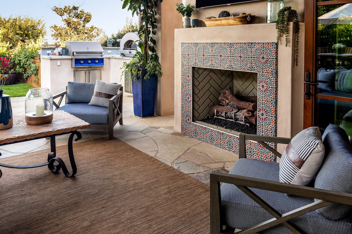 Fireplace beside the outdoor kitchen
