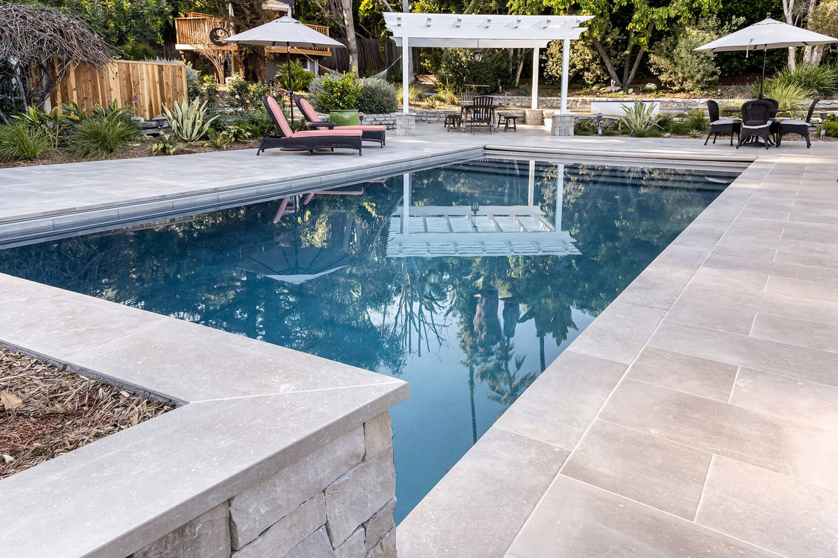 Porcelain coping along the pool