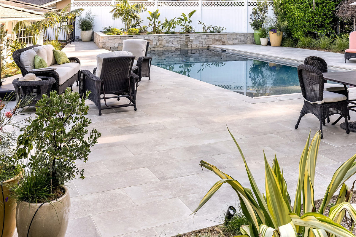 Patio seating beside the pool