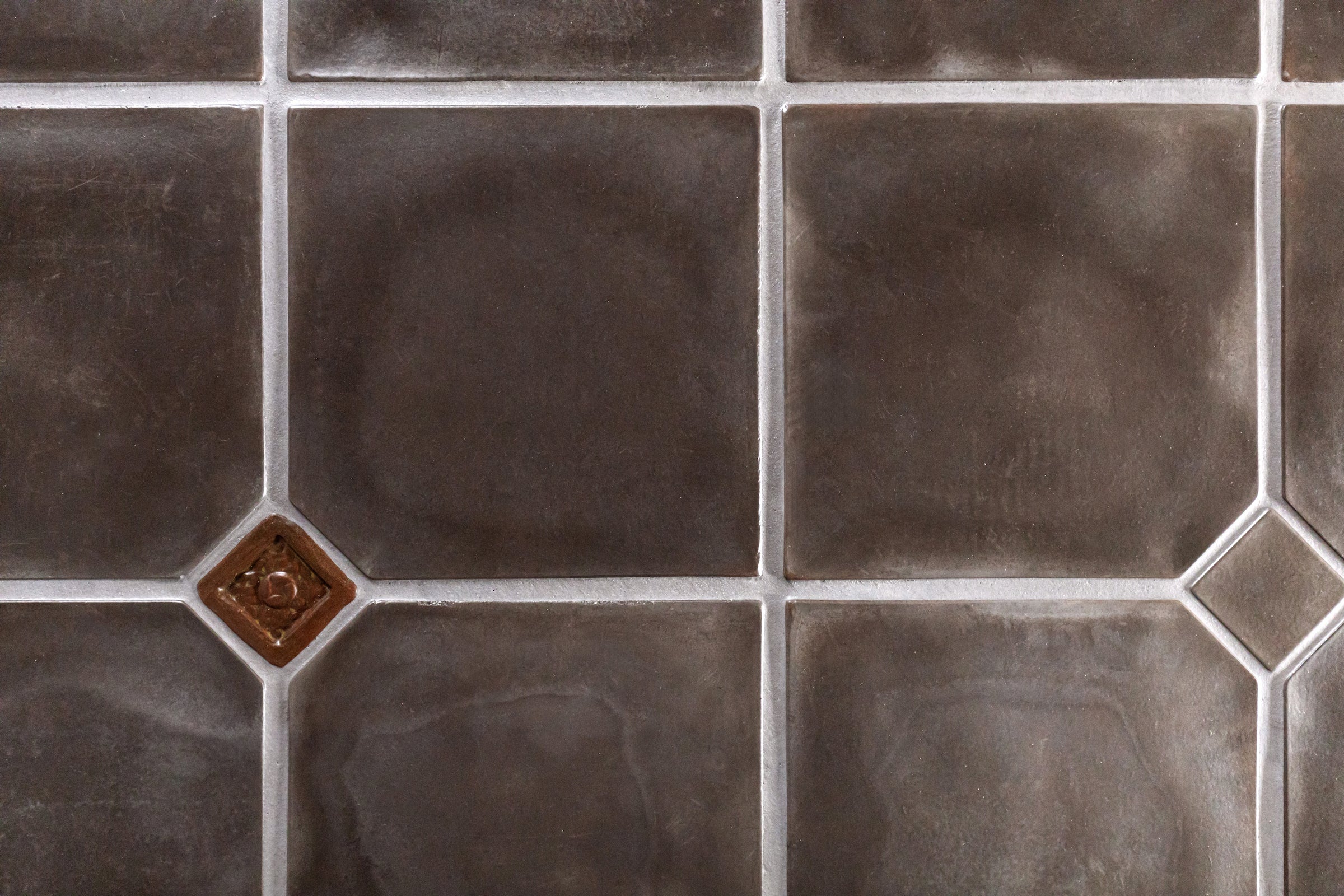 A bathroom in a Pasadena Spanish revival house floored in ARTO Artillo 12x12 in Smoke