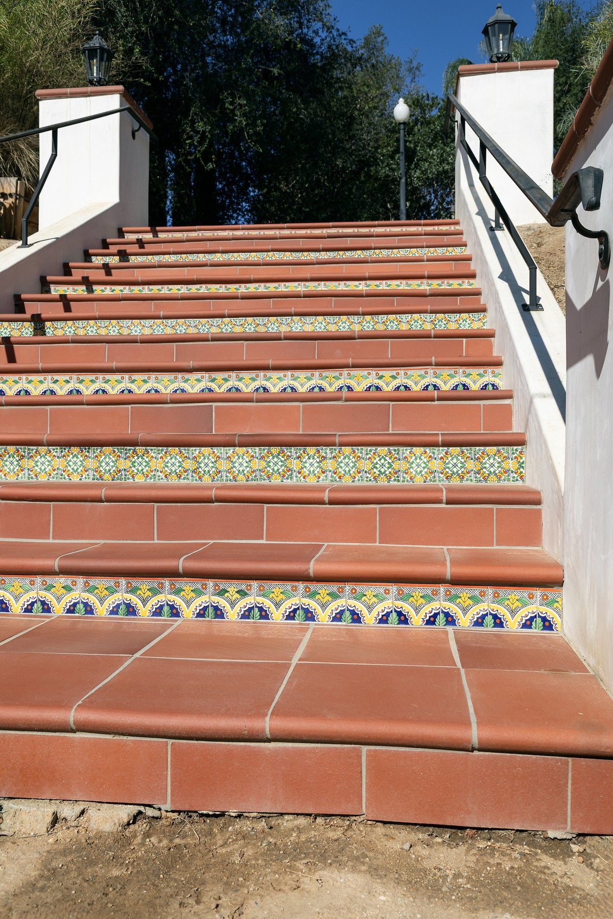 Stair treads with patterned tile risers