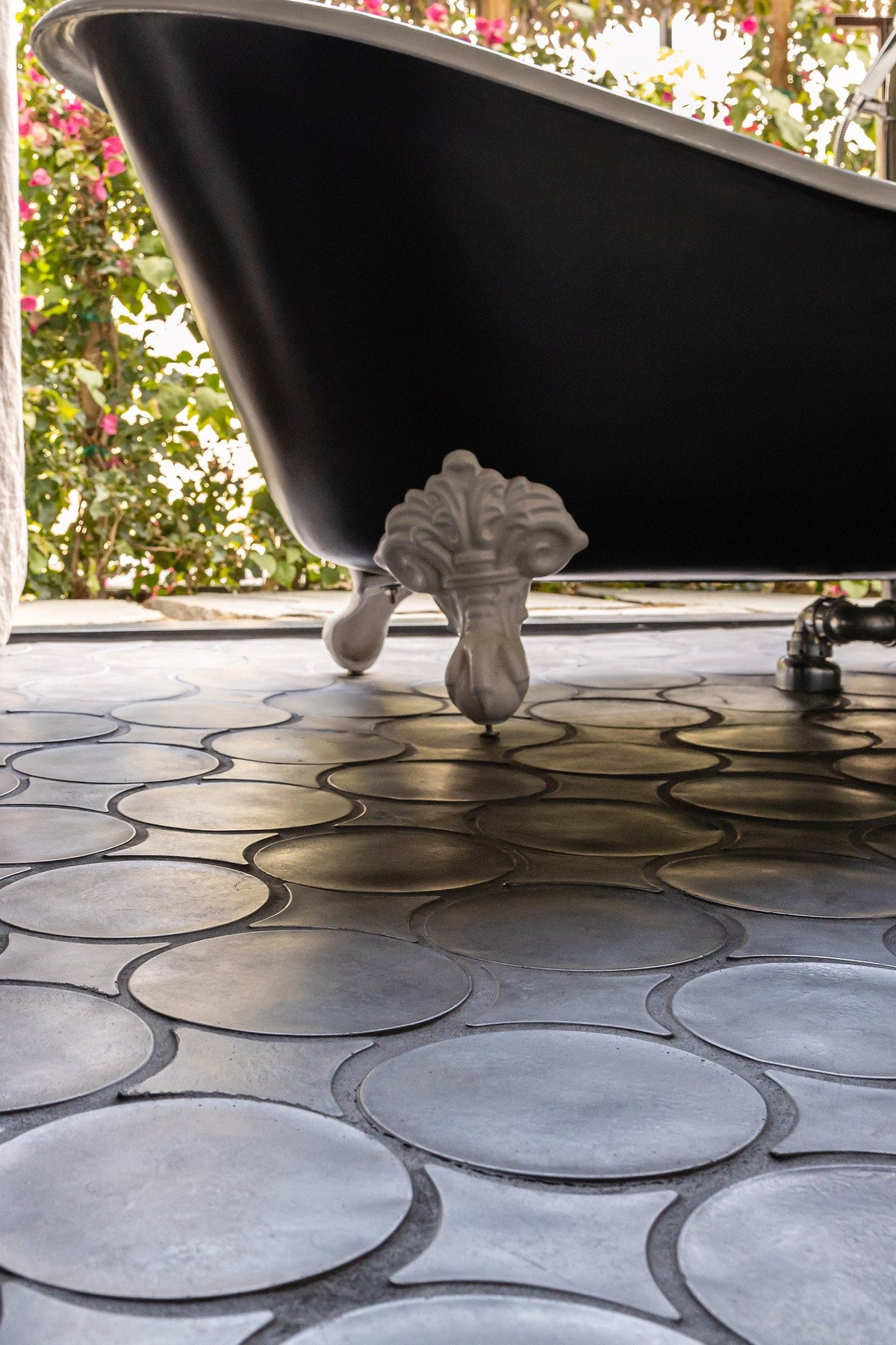 Tub feet on the tile floor