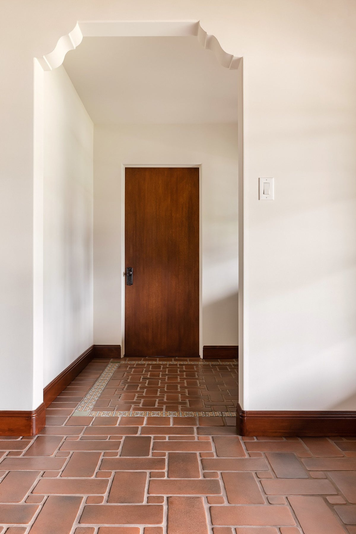 Hallway with deco tile rug border