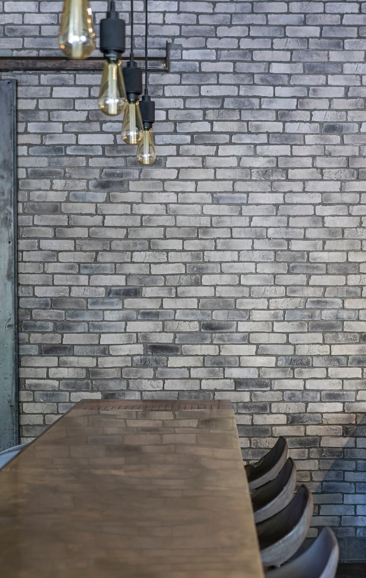 Brick wall behind pendant lights